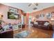 Spacious living room with hardwood floors, comfortable seating, and natural light at 2017 Asher Loop, Summerville, SC 29485