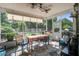 Enclosed patio featuring screened windows and a table with four chairs creating an inviting outdoor space at 2017 Asher Loop, Summerville, SC 29485