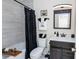 Stylish bathroom with decorative tile in shower, black fixtures, vanity, and modern decor at 2172 Palermo Pl, North Charleston, SC 29406