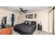 Well-lit bedroom features a large bed, nightstands, modern decor, and dark-colored furnishings at 2172 Palermo Pl, North Charleston, SC 29406