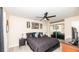 Well-lit bedroom features a large bed, nightstands, modern decor, and dark-colored furnishings at 2172 Palermo Pl, North Charleston, SC 29406