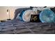 Close-up of plush bed with decorative throw pillows and comfortable bedding, complete with modern decor at 2172 Palermo Pl, North Charleston, SC 29406