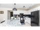 Bright kitchen with white cabinets, granite counters, subway tile backsplash, and stainless steel appliances at 2172 Palermo Pl, North Charleston, SC 29406