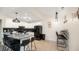 Modern kitchen featuring black appliances, white cabinets, and a stylish island with seating at 2172 Palermo Pl, North Charleston, SC 29406