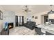 Open-concept living room with a stone fireplace and stylish decor, plus access to Kitchen at 2172 Palermo Pl, North Charleston, SC 29406