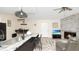 Living room features a fireplace, television, tile floors, ceiling fan, and decor at 2172 Palermo Pl, North Charleston, SC 29406