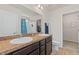 Bathroom featuring double sinks, granite countertops, walk-in shower, and a separate toilet at 251 Coosawatchie St, Summerville, SC 29485
