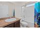 Bright bathroom featuring a shower/tub combo and vanity with laminate countertop at 251 Coosawatchie St, Summerville, SC 29485