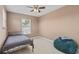 Cozy bedroom featuring neutral walls, a ceiling fan, and comfortable furniture at 251 Coosawatchie St, Summerville, SC 29485