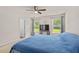Well-lit bedroom featuring neutral carpet, ceiling fan, and two windows with pleasant views at 251 Coosawatchie St, Summerville, SC 29485