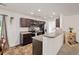 Well-lit kitchen with stainless steel appliances and dark brown cabinets at 251 Coosawatchie St, Summerville, SC 29485