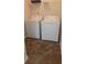 Functional laundry room features a white washer and dryer, with storage shelf above at 251 Coosawatchie St, Summerville, SC 29485