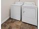 Bright laundry room featuring a washer and dryer with tile flooring at 251 Coosawatchie St, Summerville, SC 29485