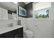 Charming bathroom with shiplap walls, a modern vanity, and natural light at 2605 Mona Ave, Charleston, SC 29414