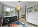 Playful bedroom with a world map rug, open concept shelving, and natural light at 2605 Mona Ave, Charleston, SC 29414