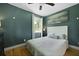 Cozy bedroom featuring a comfortable bed and calming teal-colored walls at 2605 Mona Ave, Charleston, SC 29414