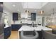 Bright, modern kitchen with stainless steel appliances, stylish cabinetry, and a marble island with seating at 2605 Mona Ave, Charleston, SC 29414
