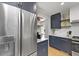Modern kitchen with stainless steel appliances, navy cabinets, white countertops and backsplash at 2605 Mona Ave, Charleston, SC 29414