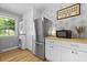 Bright kitchen features stainless steel appliances and a washer-dryer setup at 2605 Mona Ave, Charleston, SC 29414