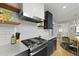 Updated kitchen featuring stainless steel appliances, white subway tile, and sleek, navy blue cabinetry at 2605 Mona Ave, Charleston, SC 29414