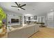 Spacious living room featuring a modern ceiling fan, skylight and wood floors at 2605 Mona Ave, Charleston, SC 29414