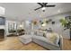 Open-concept living room with modern lighting, hardwood floors, and stylish furnishings; great for entertaining at 2605 Mona Ave, Charleston, SC 29414
