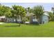 View of the lush, green lawn and exterior bench seating, perfect for enjoying the outdoors at 2605 Mona Ave, Charleston, SC 29414