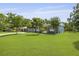 View of the lush, green lawn and exterior bench seating, perfect for enjoying the outdoors at 2605 Mona Ave, Charleston, SC 29414