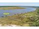 Wide aerial view of multiple docks extending into the water surrounded by marshland at 2649 Starfish Dr, Johns Island, SC 29455
