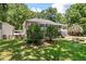 Expansive backyard with a deck, mature trees, and plenty of space for outdoor activities at 2649 Starfish Dr, Johns Island, SC 29455