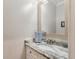 Well-lit bathroom featuring a granite vanity, silver fixtures and large wall mirror at 2649 Starfish Dr, Johns Island, SC 29455