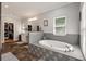 Inviting bathroom with a soaking tub, tiled accents, and generous counter space at 2649 Starfish Dr, Johns Island, SC 29455