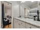 Bright bathroom featuring a white marble countertop vanity, and view into the connected bedroom at 2649 Starfish Dr, Johns Island, SC 29455