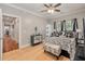 Bright bedroom featuring a hardwood floors, a ceiling fan, and natural light streaming through the window at 2649 Starfish Dr, Johns Island, SC 29455