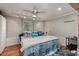 Cozy bedroom featuring stylish decor, ample natural light, and wood-look flooring at 2649 Starfish Dr, Johns Island, SC 29455
