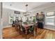 Elegant dining room featuring a large wooden table, stylish chairs, and ample natural light at 2649 Starfish Dr, Johns Island, SC 29455
