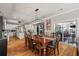 Open-concept dining area connecting seamlessly to a modern kitchen and outdoor patio at 2649 Starfish Dr, Johns Island, SC 29455
