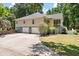 Rear of the home showing a three-car garage and a screened porch on the second story at 2649 Starfish Dr, Johns Island, SC 29455