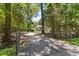 Secluded home with a long driveway and mature trees providing privacy and natural beauty at 2649 Starfish Dr, Johns Island, SC 29455