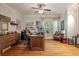 Cozy office featuring a large desk, hardwood floors, and a ceiling fan at 2649 Starfish Dr, Johns Island, SC 29455