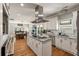Modern kitchen featuring white cabinets, a central island, and stainless steel appliances at 2649 Starfish Dr, Johns Island, SC 29455