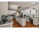 Bright kitchen with white cabinets, granite counters, stainless appliances, and hardwood floors at 2649 Starfish Dr, Johns Island, SC 29455