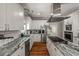 Well-equipped kitchen with granite countertops, stainless steel appliances, and hardwood flooring at 2649 Starfish Dr, Johns Island, SC 29455