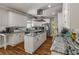 The well-appointed kitchen features an island, stainless appliances, and granite counters at 2649 Starfish Dr, Johns Island, SC 29455