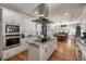 Bright kitchen featuring white cabinets, granite countertops, stainless steel appliances, and a central island at 2649 Starfish Dr, Johns Island, SC 29455