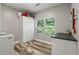 Functional laundry room with modern appliances, ample storage, and natural light at 2649 Starfish Dr, Johns Island, SC 29455