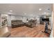 Inviting living room area with modern sofas, exercise bike, and adjacent kitchen at 2649 Starfish Dr, Johns Island, SC 29455