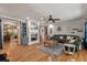 Comfortable living room showcasing hardwood floors, a fireplace, built-in shelving, and a plush leather sofa at 2649 Starfish Dr, Johns Island, SC 29455