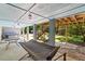 Covered outdoor patio with a hammock and stairs leading to the backyard and a gazebo at 2649 Starfish Dr, Johns Island, SC 29455