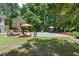 Backyard swimming pool surrounded by lush greenery and patio furniture for relaxing and entertaining outdoors at 2649 Starfish Dr, Johns Island, SC 29455